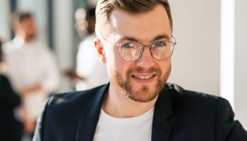 Close-up portrait of handsome office employee